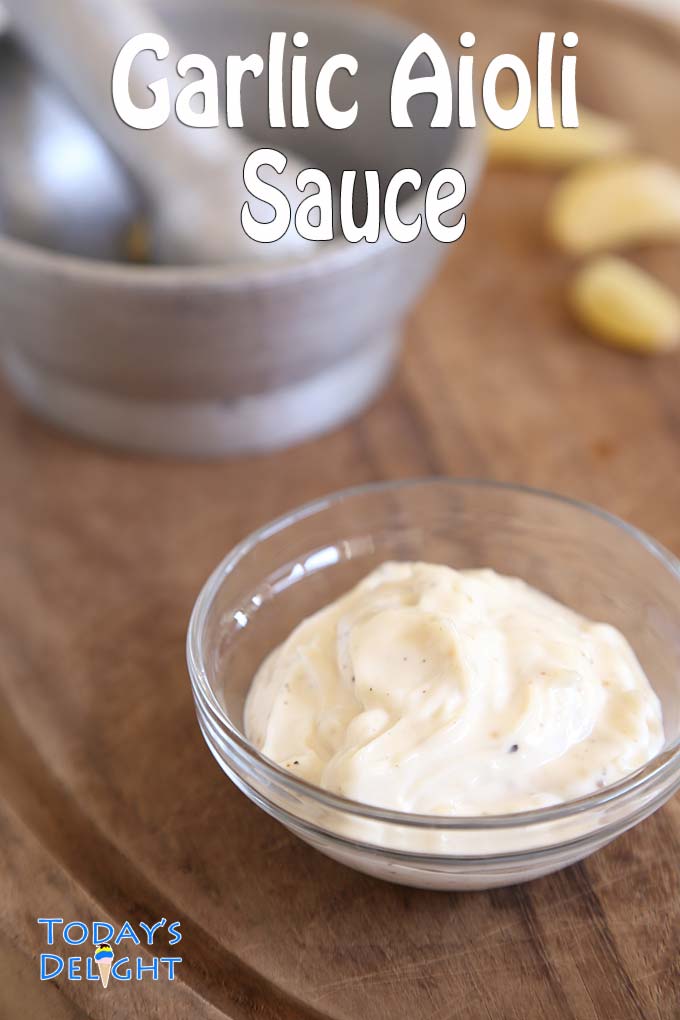 Garlic aioli sauce prepared in a mortar and pestle.