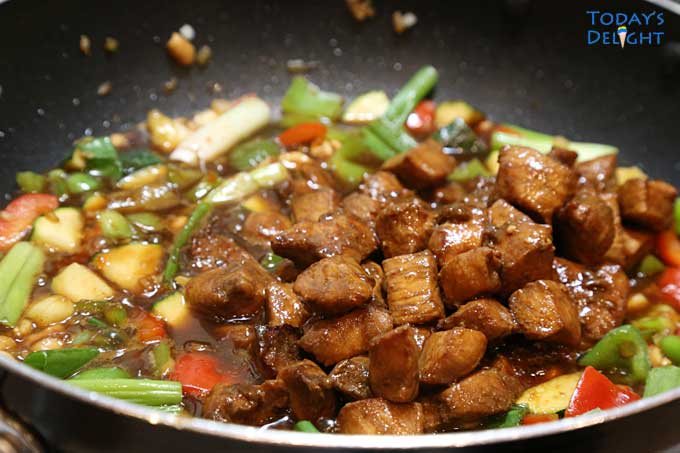 Panda Express Kung Pao Chicken Recipe (Copycat) cooked in hot skillet.