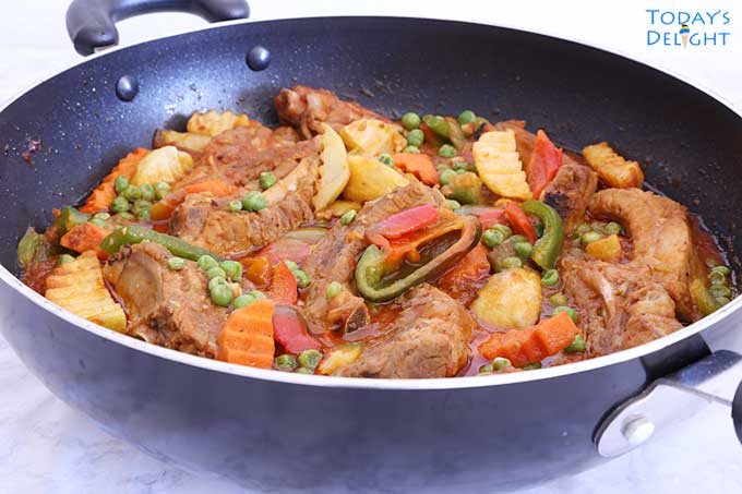 Slow Cooked Curry Ribs in a skillet.