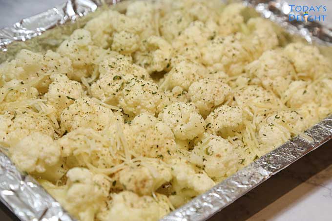 Easy roasted garlic cauliflower topped with bread crumbs & Parmesan.