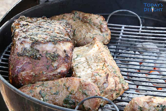 Marinated Lemon Pepper baby back ribs and pork in grill.