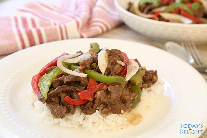 Beef dish over white rice.