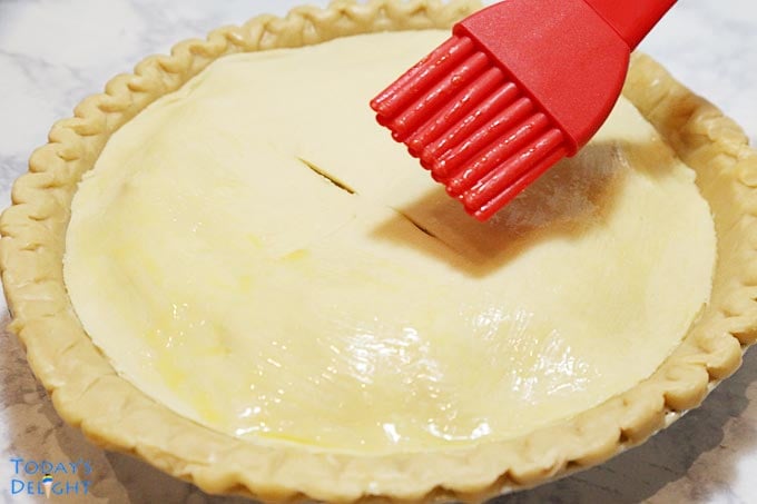 Top crust of Turkey Pot Pie is brushed with egg wash.