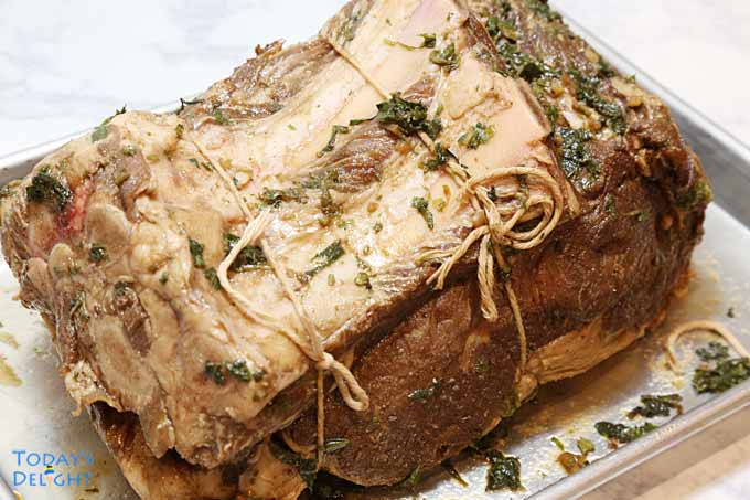 Rib bones attached to prime rib with butcher twine.