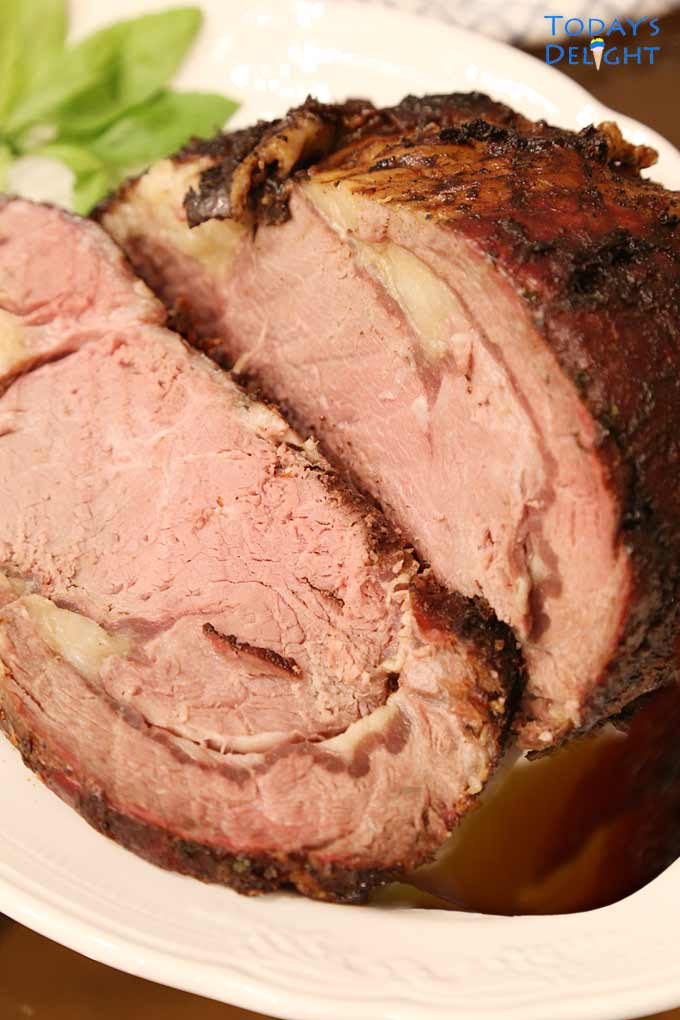 Sliced grilled prime rib roast medium well done.