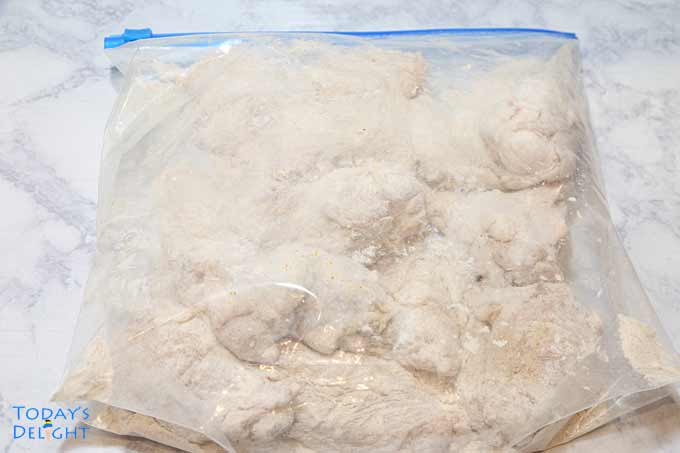 Breaded chicken wings in zip lock bag.