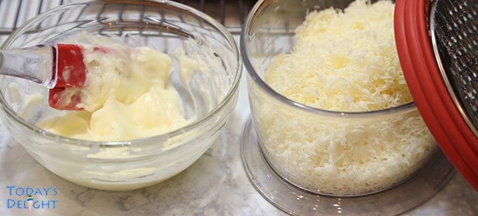 Buttercream and grated cheese for topping sweet bread rolls.