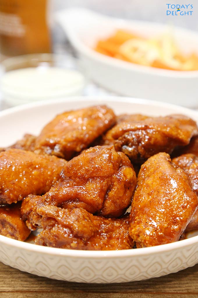 Crispy Sweet and Spicy Chicken Wings in bowl is Today's Delight.