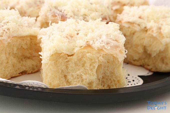 Sweet bread rolls topped with buttercream and grated keso de bola (aged sharp gouda cheese).