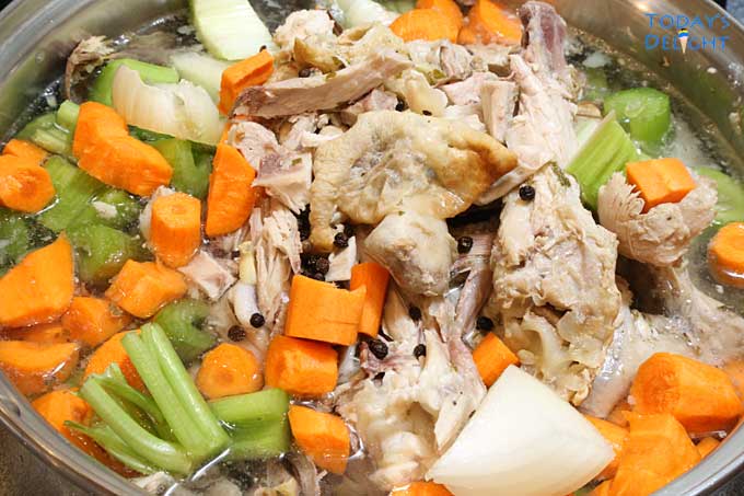 Making turkey broth with all the ingredients in pot.