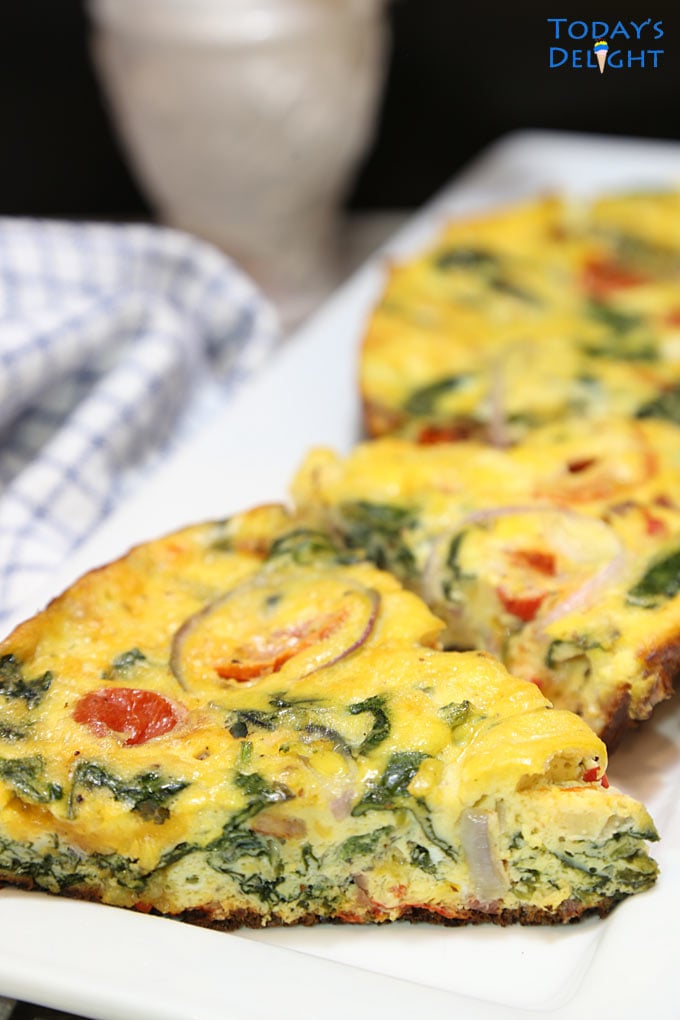 Slices of Bacon Spinach Frittata in a serving platter.