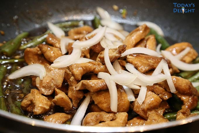 Chicken Breast and Green Bean Stir Fry in wok.