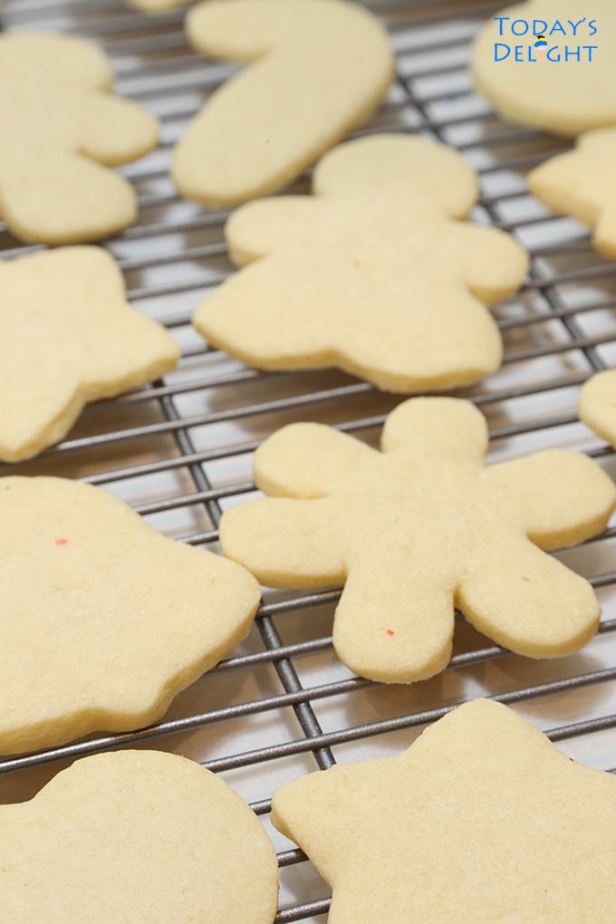 Cut out sugar cookies on wire rack.