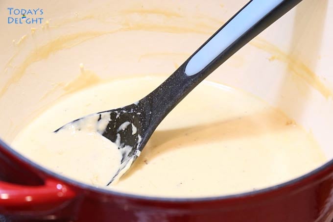 Making the white sauce or Bechamel sauce for the lasagna dish.