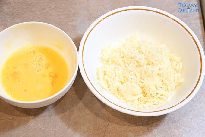 Beaten egg and Parmesan cheese in separate bowls.
