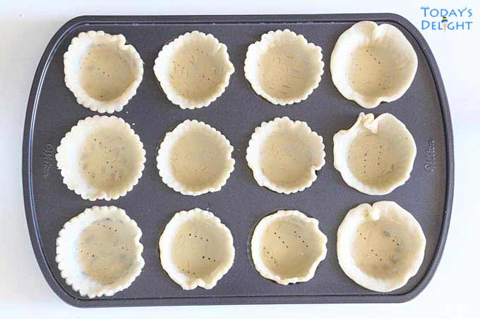 Mini Quiche shells in tart pan.