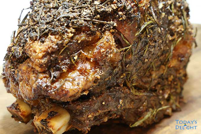 A cooked medium-well Standing Rib Roast with rub.