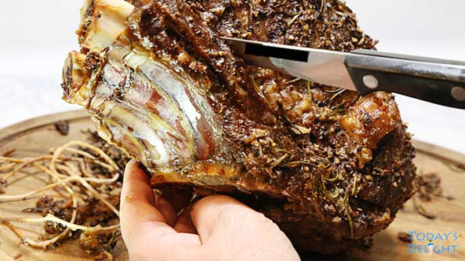 Kitchen twine was removed from roast, then removing the rib bones with a boning knife.
