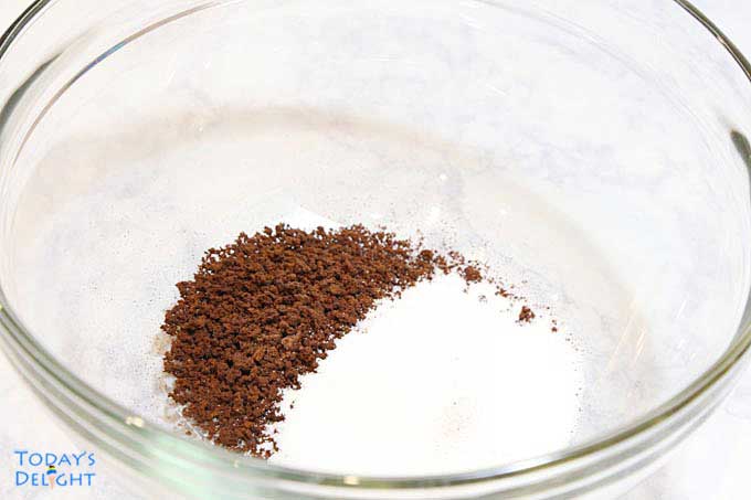 Instant coffee and sugar in mixing bowl.
