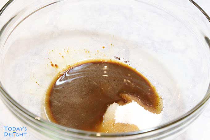 Instant coffee, sugar and boiling water in mixer.
