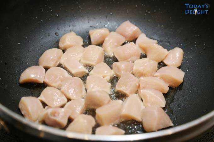 Browning chicken in skillet.