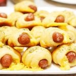 Crescent Roll Pigs in a Blanket layered on top of each other..