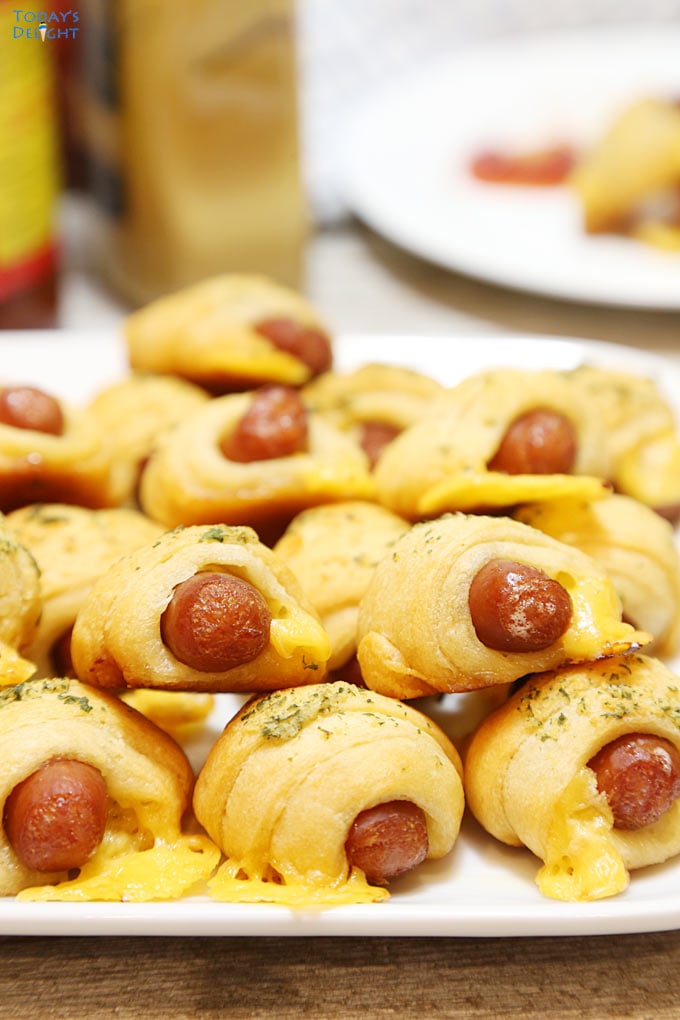 Crescent Roll Pigs in a Blanket and condiments is Today's Delight.