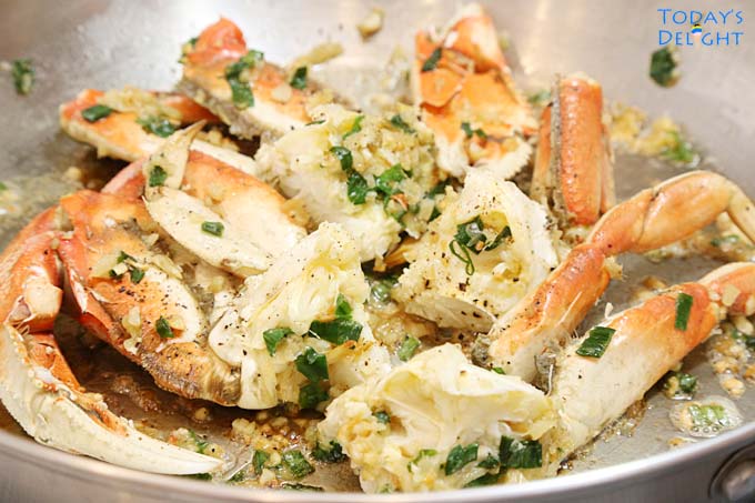 Stir fry crab in skillet.