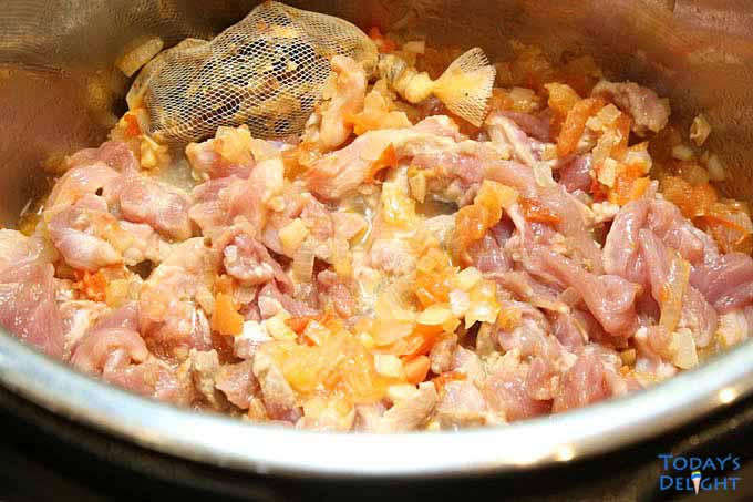 Ginisang munggo ingredients sauteed in instant pot.