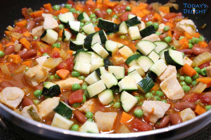 Zucchini and green peas added to stew.
