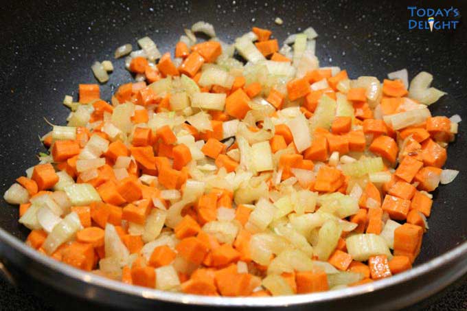 Onion, carrots and celery in skillet, known as mirepoix.