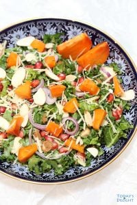 Persimmon Pomegranate Salad in a plate.