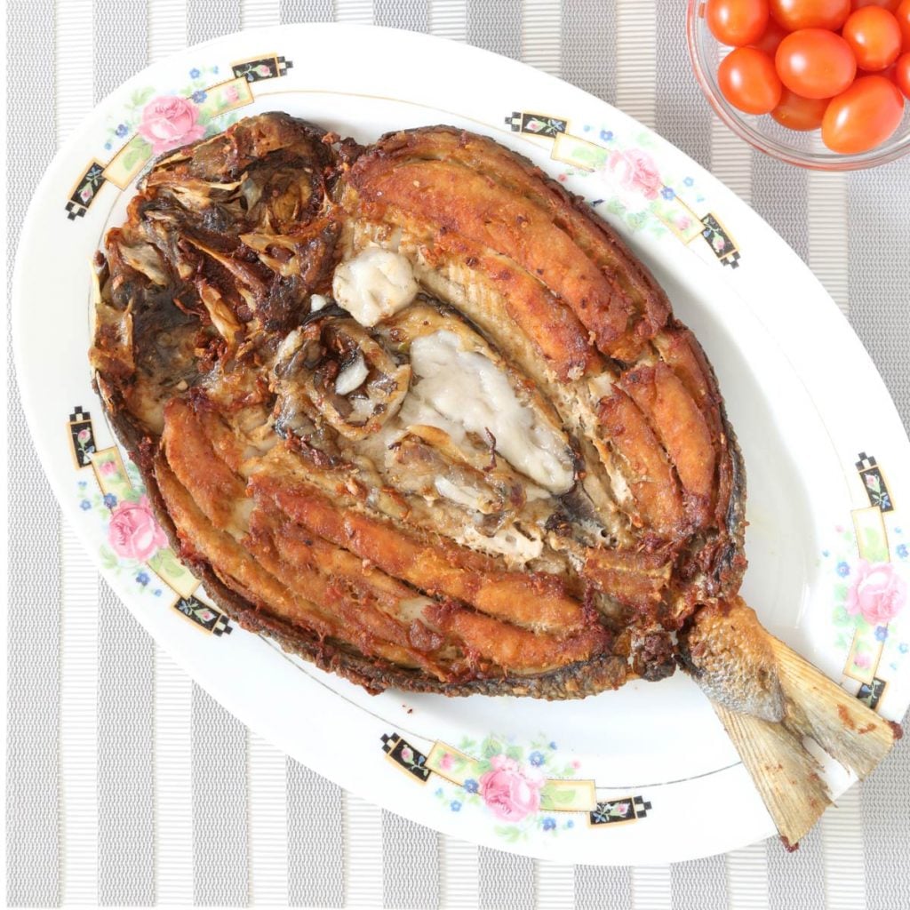 Daing na bangus is fried marinated milkfish and cherry tomatoes.