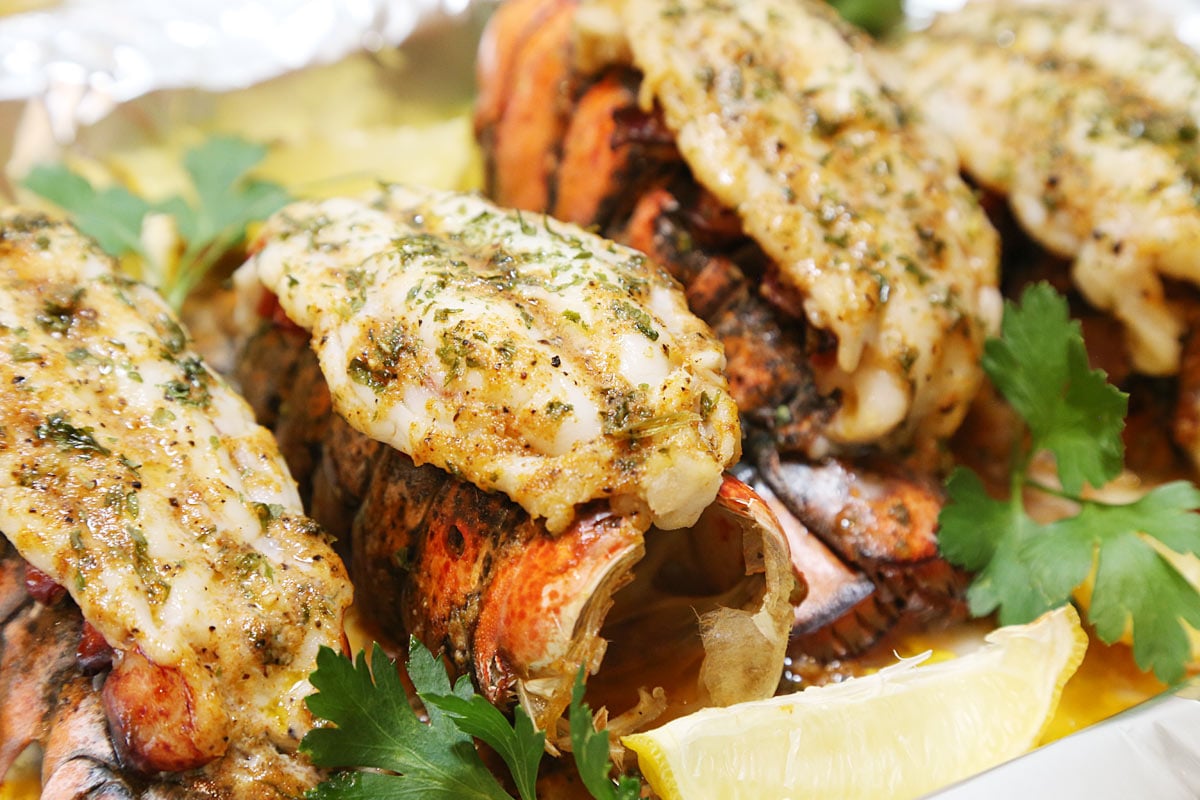 3 broiled lobster meat on top of lobster shell.