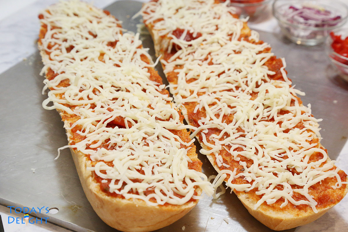 French bread sliced lengthwise in half then topped with pizza sauce and cheese.