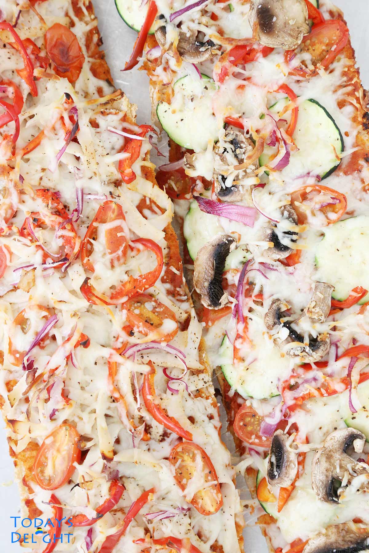 French bread cut lengthwise and made Veggie French Bread Pizza.