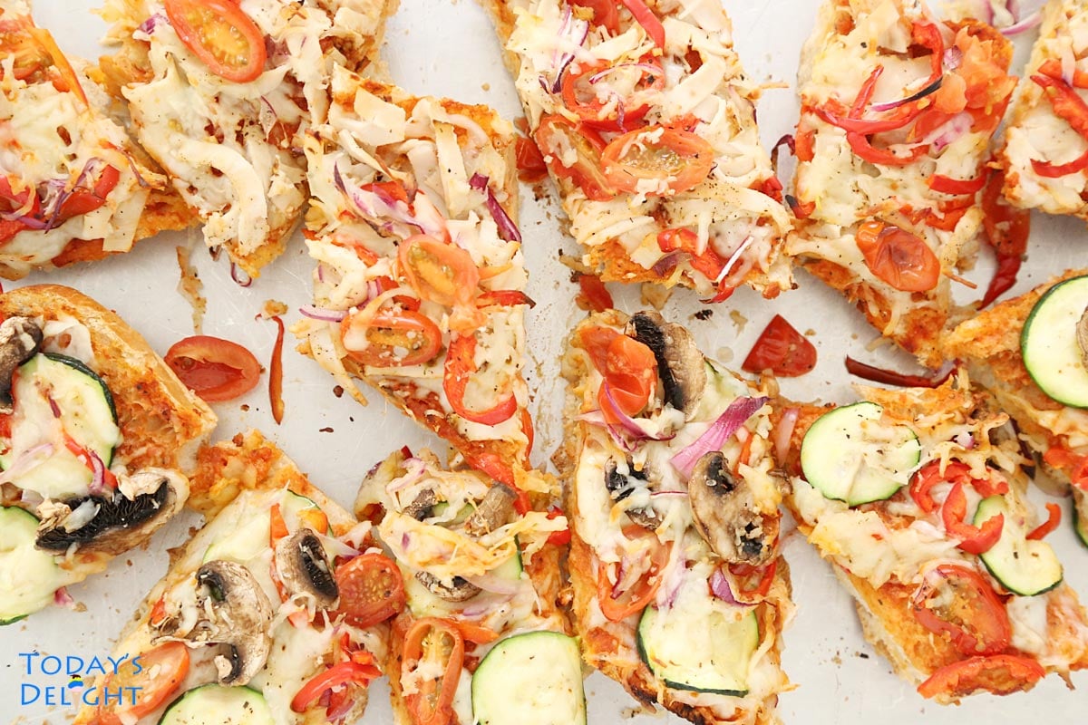 French bread pizza sliced into pieces.