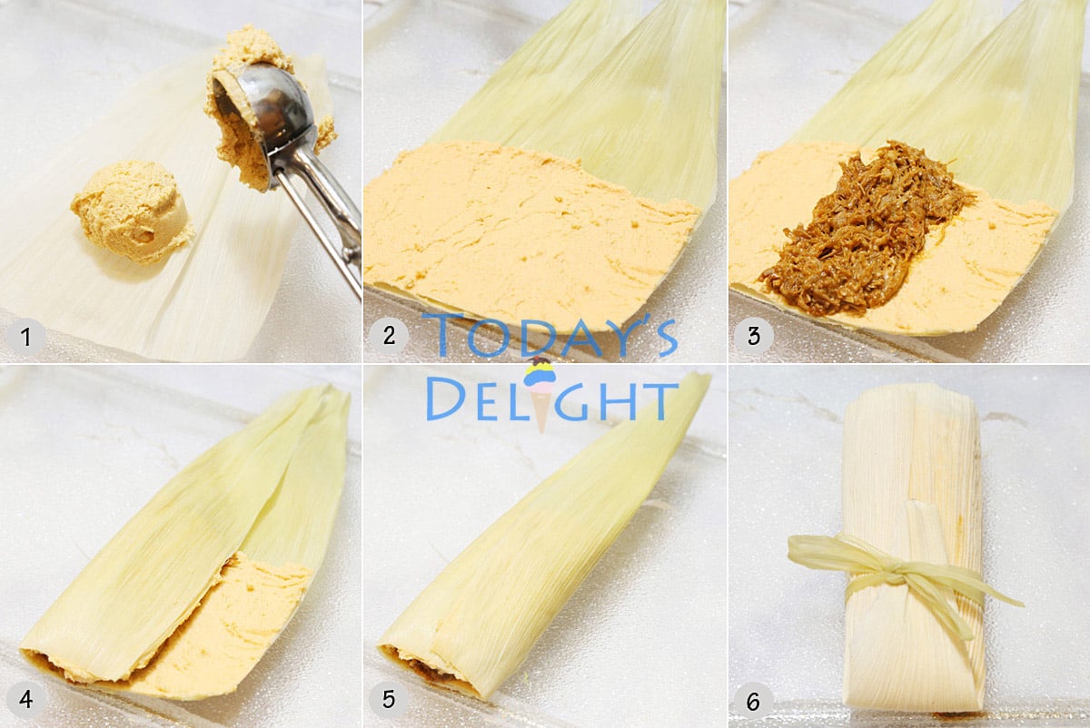 A scoop full of masa dough spread in the corn husk, the pork filling added in the center and husk folded and tied.