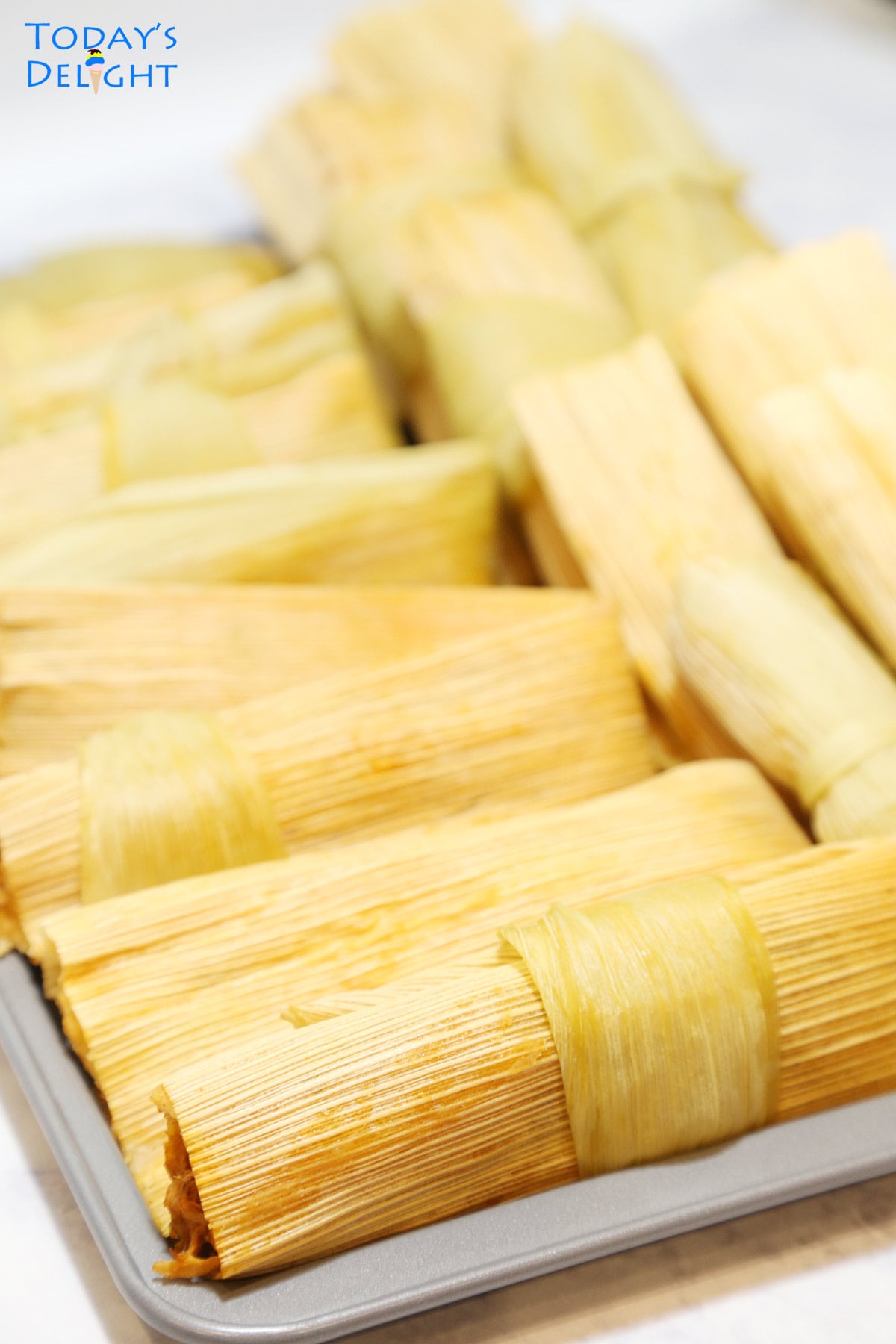 Tray of wrapped Mexican tamales.