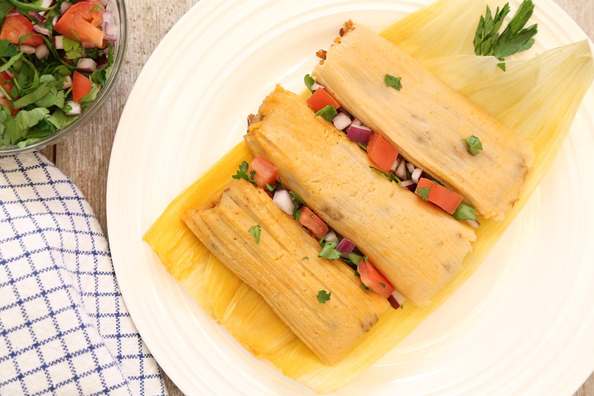 3 unwrap tamales with pico de gallo in between.