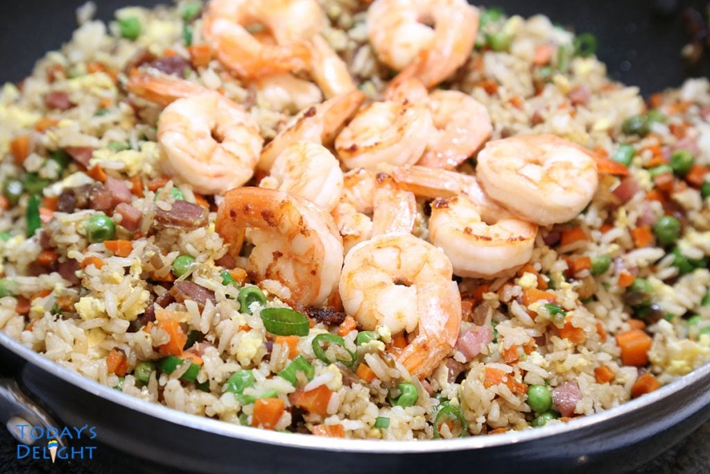 Half cooked shrimp added to fried rice at the end of cooking.