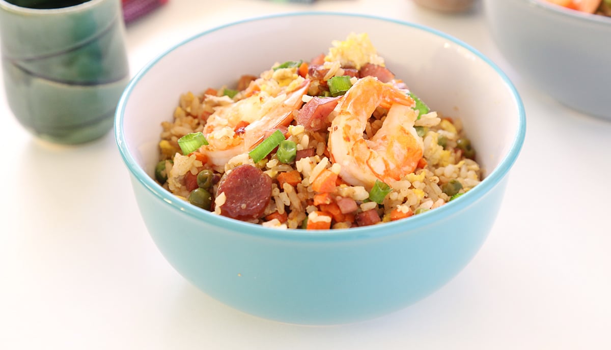 Shrimp Fried Rice with Chinese Sausage and Ham and vegetables in a bowl.