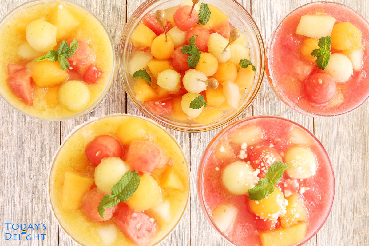 4 glasses of melon ball drink and 1 big bowl with melon garnished with fresh mint leaves.