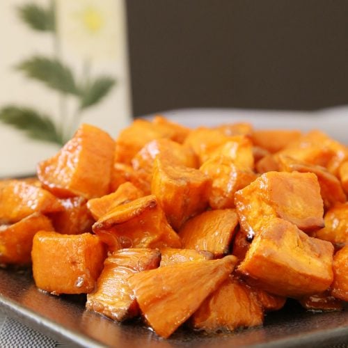 A plate full of roasted sweet potatoes.
