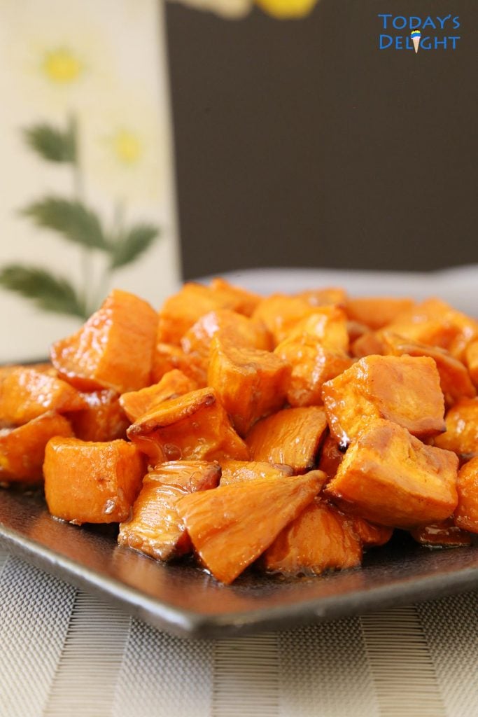 A plate full of roasted sweet potatoes.