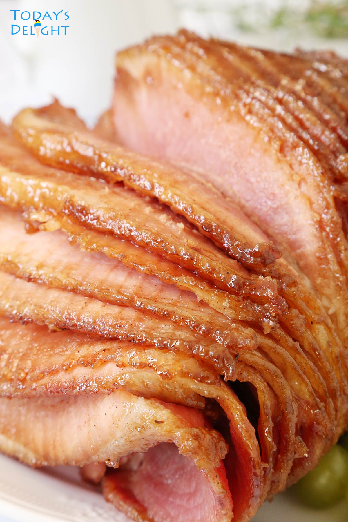 Whole glazed ham fanned out to show the meat.