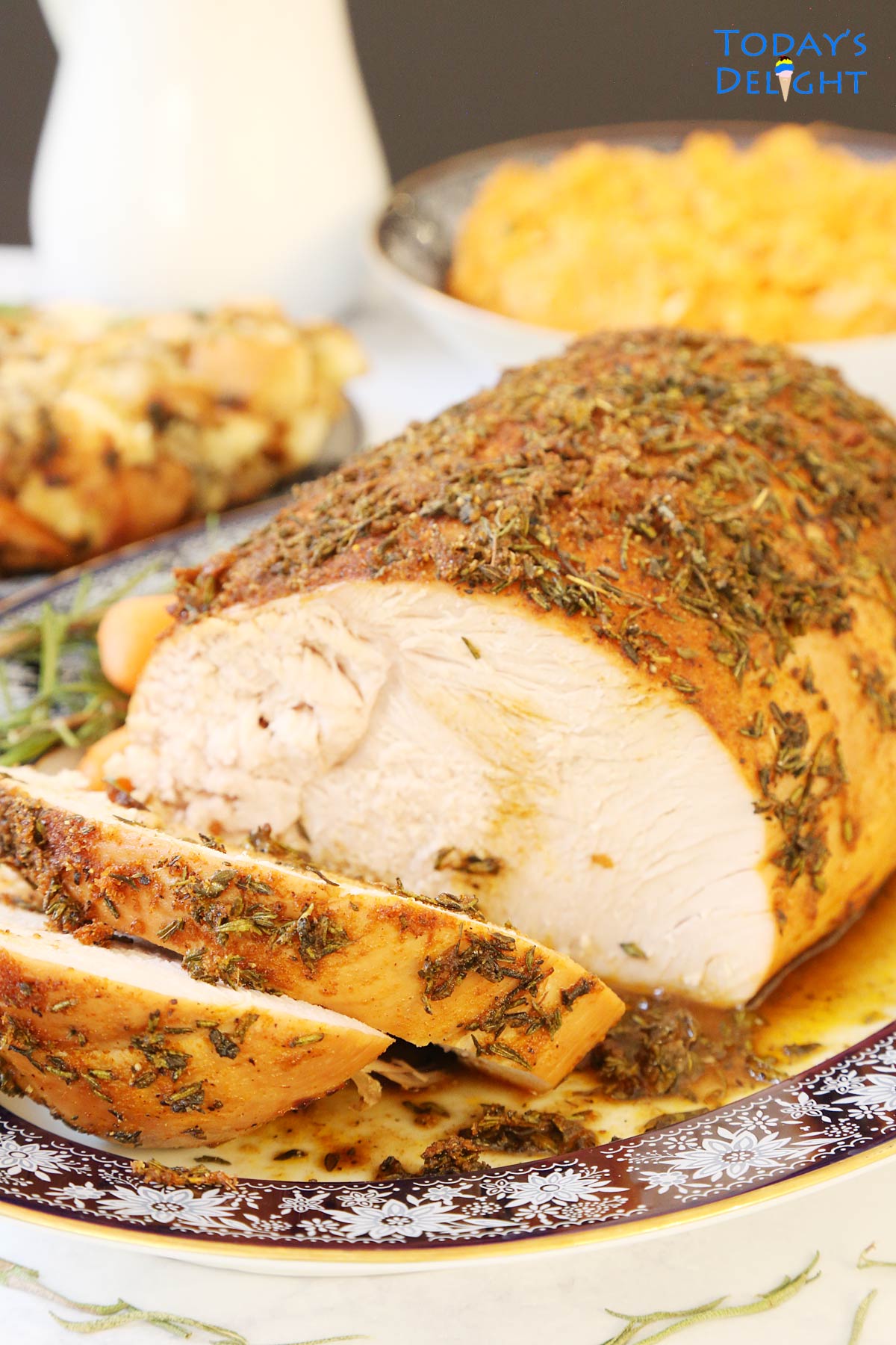 Sliced Boneless Turkey Breast Roast in a platter and sides.