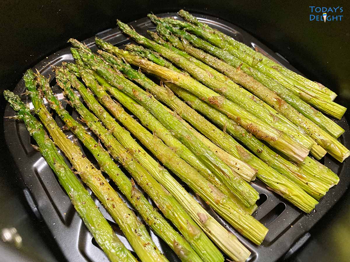 Cooking asparagus in air fryer for 7 minutes.