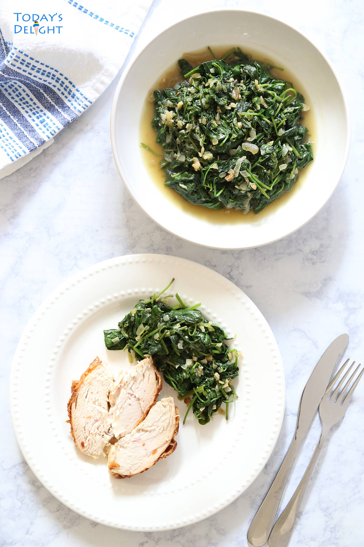 Sauteed spinach in a serving dish and a plate of roasted chicken with a side of spinach.